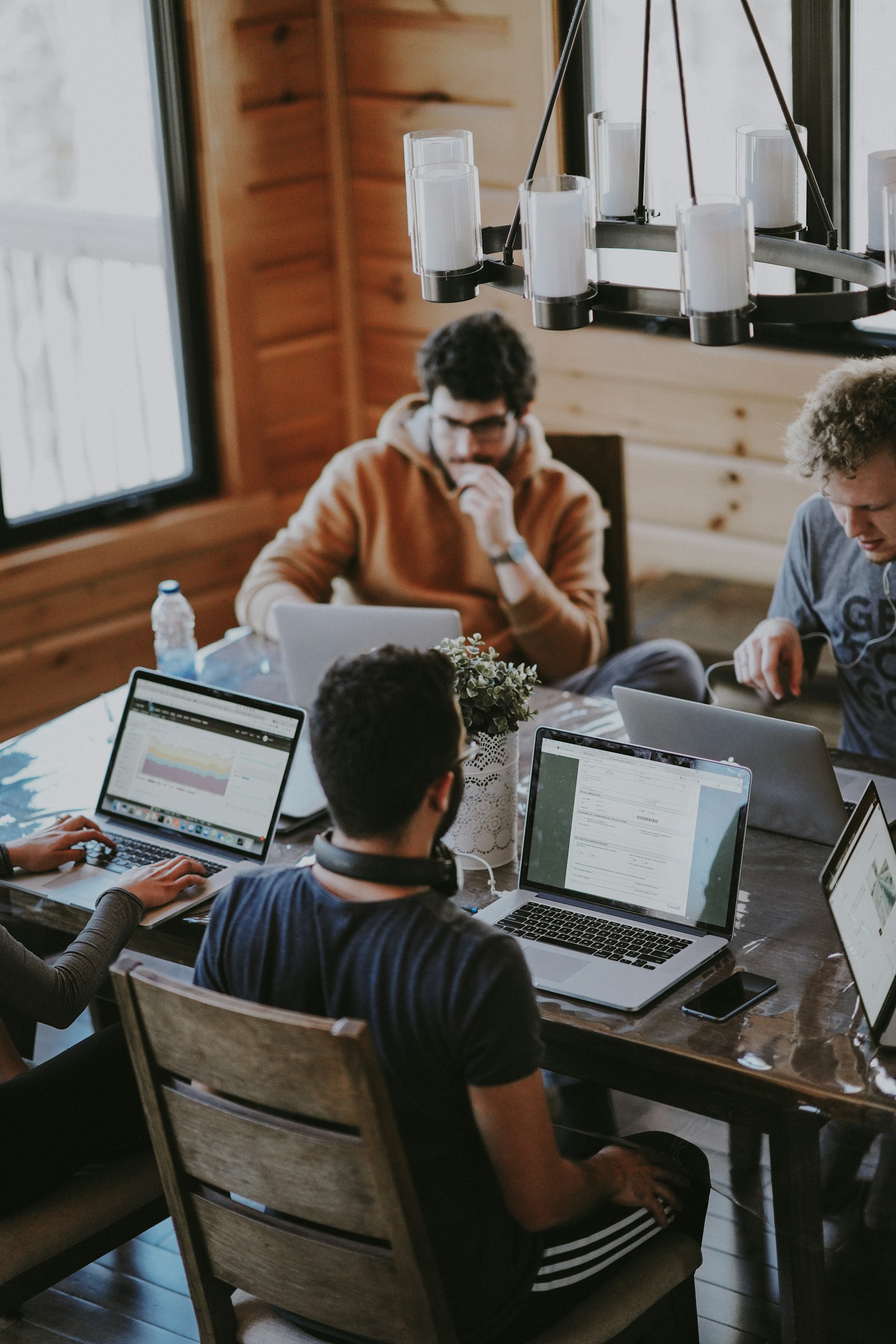 People considering information together around a table